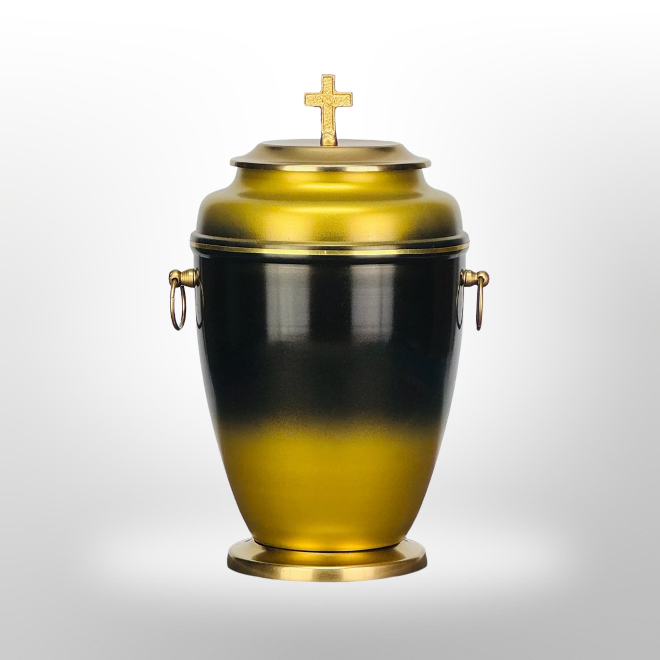 Urne in Schwarz-Gold mit Kreuz.